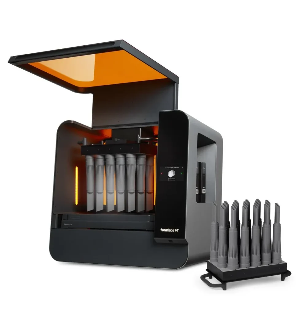 Formlabs Form 3L industrial 3D printer with a ready-made series of technical components printed from SLA resin.