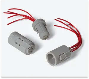 Custom electrical connector housings printed from grey, fire-resistant SLA resin as functional prototypes for electronics.