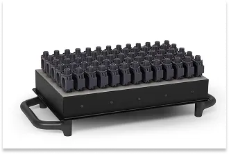 The working platform of an SLA 3D printer densely filled with a series of identical technical components, illustrating low-volume production.