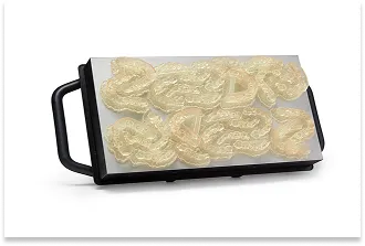 A series of precision medical components, dental caps, printed from transparent resin using SLA technology.