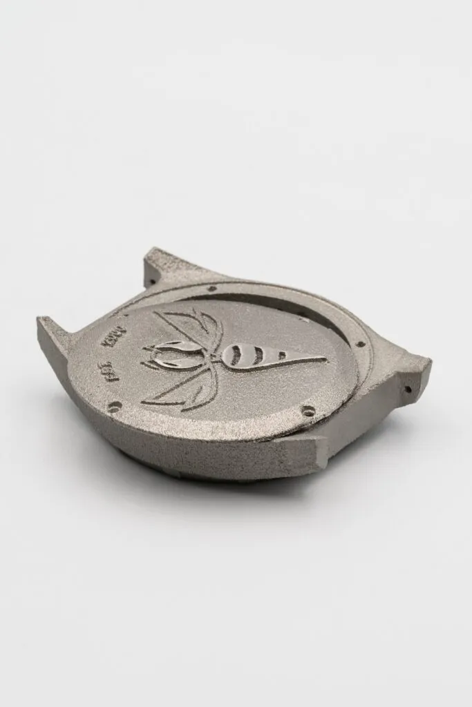 Finished watch case with a bee motif on the case back, created using 3D printing technology in Wrocław by Spes3D.