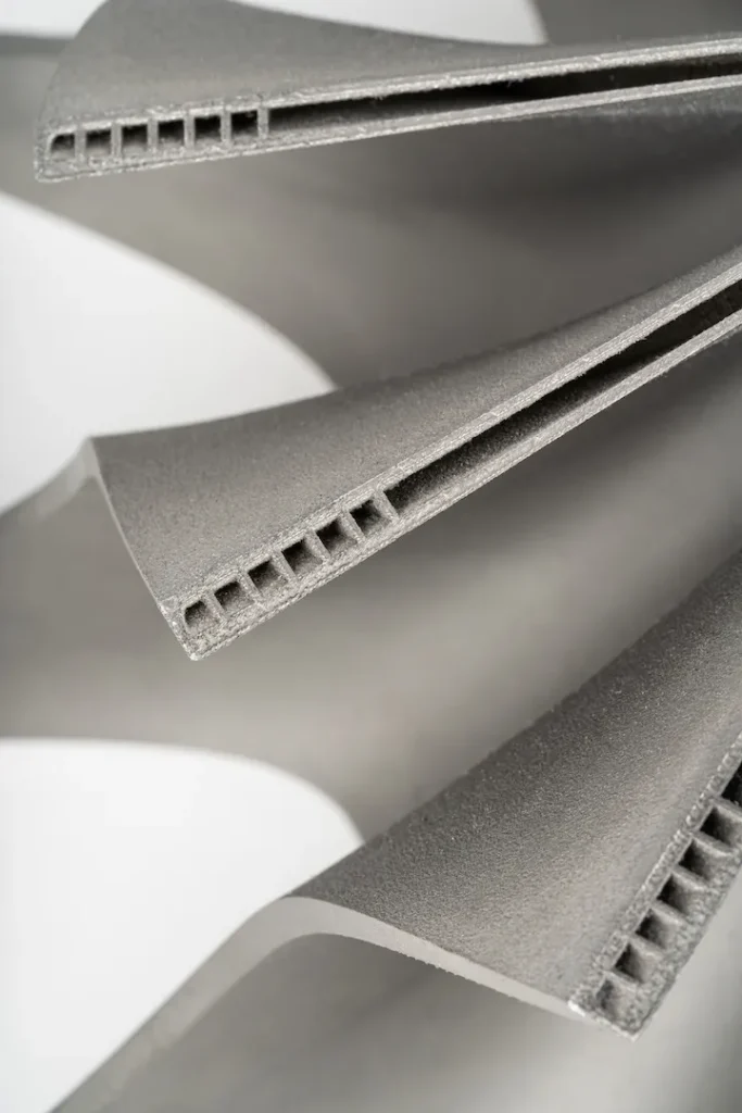 Close-up of a detail – a 3D printed metal impeller with complex geometry.